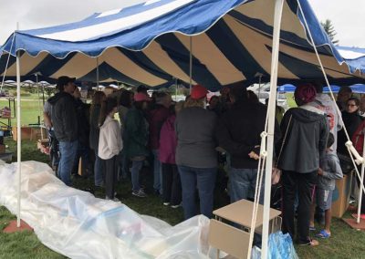 Auction tent with bidders