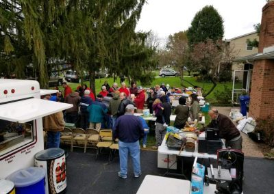 Columbus Estate auction bidders looking at items